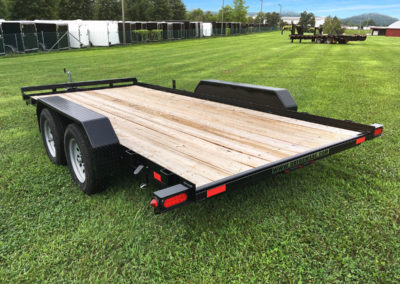 Car hauler trailer with slide-in ramps