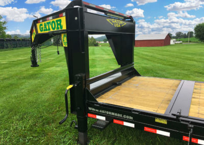 Low profile tilt bed equipment trailer