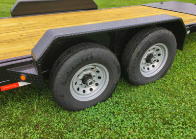 Low profile tilt bed equipment trailer